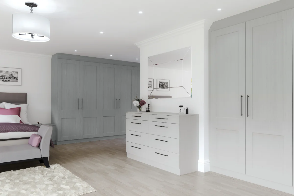 Made-to-measure fitted wardrobes in a contemporary bedroom by Riggzy Kitchens in Eastbourne.