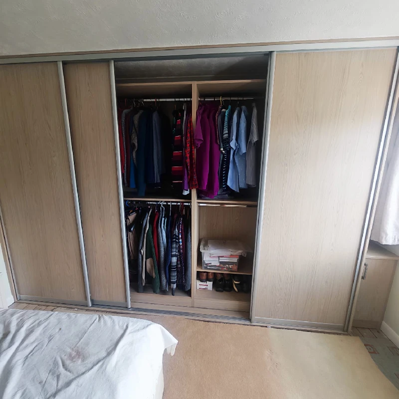 Custom wardrobe interior with double hanging rails and shelving in Hailsham, East Sussex